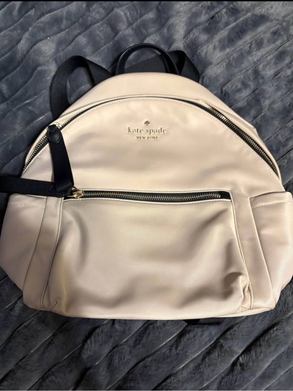 kate spade cream backpack with black straps